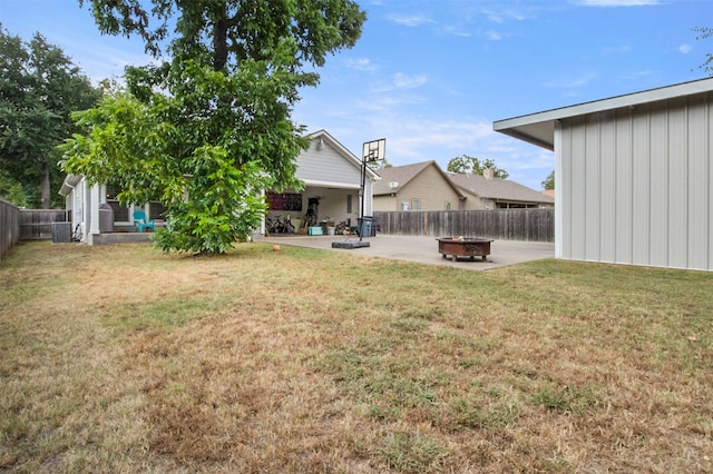 view of yard featuring a patio area and an outdoor fire pit