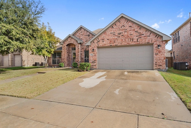 view of front facade featuring central AC, a front lawn, and a garage