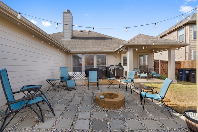 view of patio featuring a fire pit and a grill