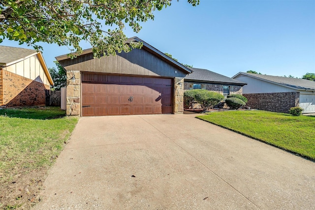 view of front facade with a front yard and a garage