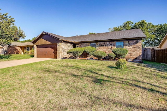 ranch-style home featuring a front yard and a garage