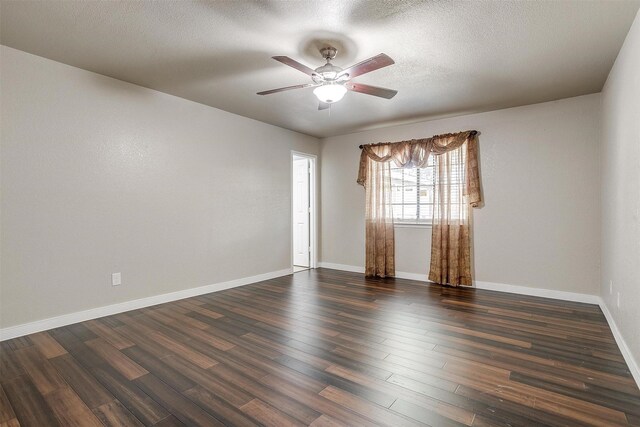 unfurnished room featuring a textured ceiling, ceiling fan, and dark wood-type flooring