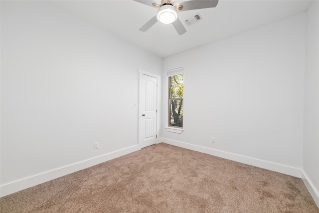 spare room with carpet flooring and ceiling fan