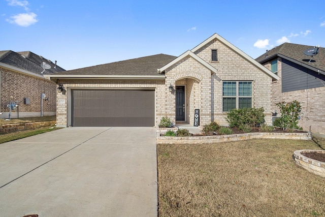 view of front facade featuring a front yard and a garage