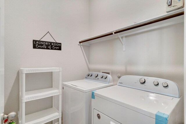 laundry area with washing machine and dryer