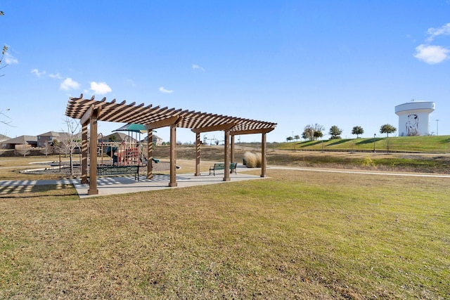 exterior space featuring a pergola, a playground, and a lawn