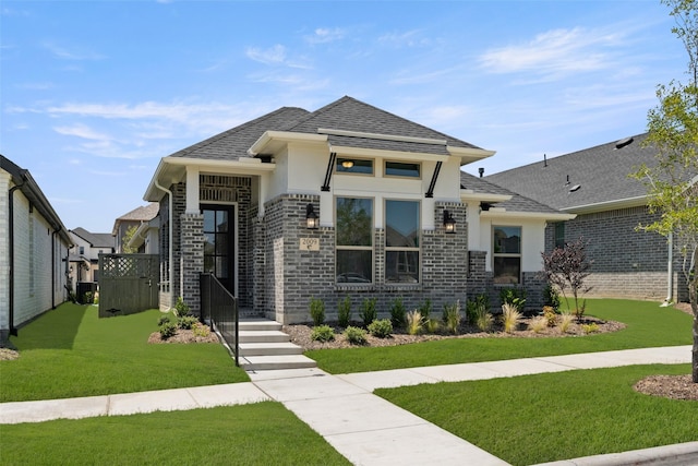 2009 Elm Pl, Northlake, TX 76247 - view of front of property with stucco siding, a front yard, roof with shingles, and brick siding