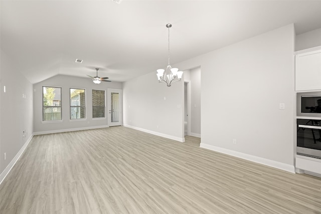 2009 Elm Pl, Northlake, TX 76247 - unfurnished living room featuring light wood-style flooring, a ceiling fan, a chandelier, and vaulted ceiling