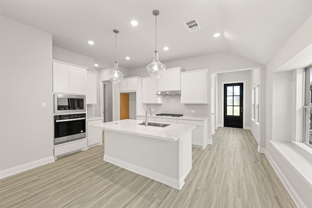 2009 Elm Pl, Northlake, TX 76247 - kitchen with stainless steel appliances, light wood-style flooring, light countertops, tasteful backsplash, and recessed lighting