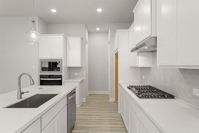 2009 Elm Pl, Northlake, TX 76247 - kitchen featuring stainless steel appliances, ventilation hood, light countertops, white cabinetry, and recessed lighting
