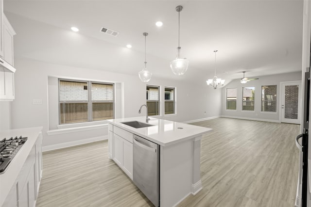 2009 Elm Pl, Northlake, TX 76247 - kitchen with appliances with stainless steel finishes, light wood finished floors, light countertops, a ceiling fan, and recessed lighting