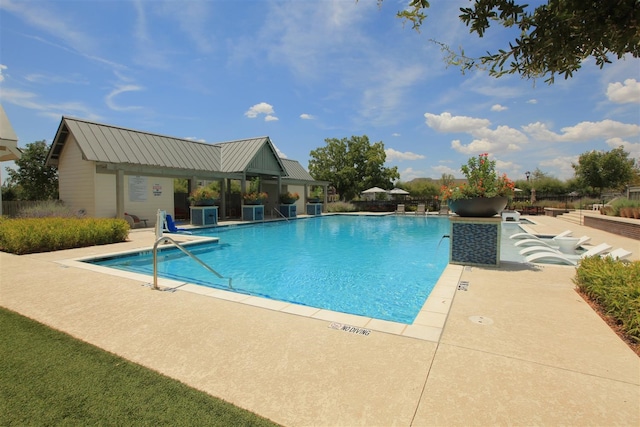 view of swimming pool with a patio and central AC unit