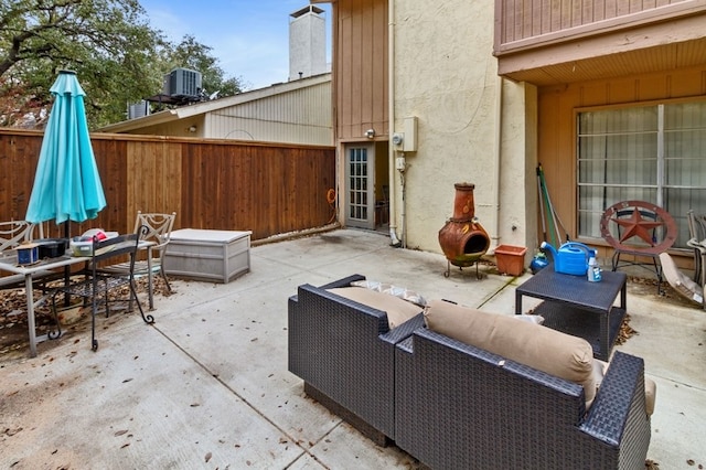 view of patio with an outdoor living space and cooling unit