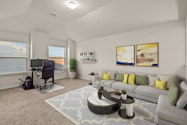 carpeted living room featuring lofted ceiling