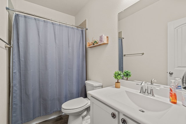 bathroom featuring a shower with curtain, vanity, toilet, and hardwood / wood-style flooring