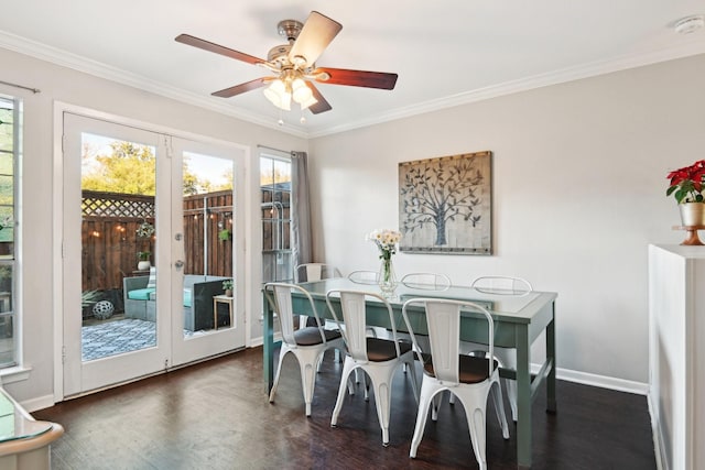 dining space with ceiling fan, dark hardwood / wood-style flooring, and ornamental molding