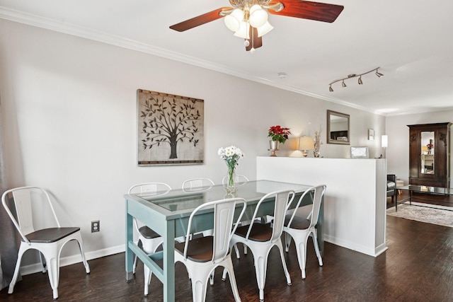 dining area with ceiling fan, ornamental molding, and dark hardwood / wood-style flooring