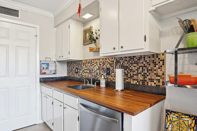 kitchen featuring backsplash, stainless steel dishwasher, ornamental molding, sink, and white cabinetry