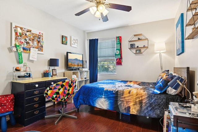 bedroom featuring ceiling fan and dark wood-type flooring