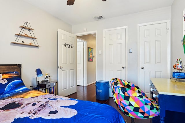 bedroom with ceiling fan and dark hardwood / wood-style flooring