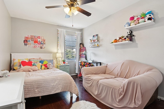 bedroom with ceiling fan and dark wood-type flooring