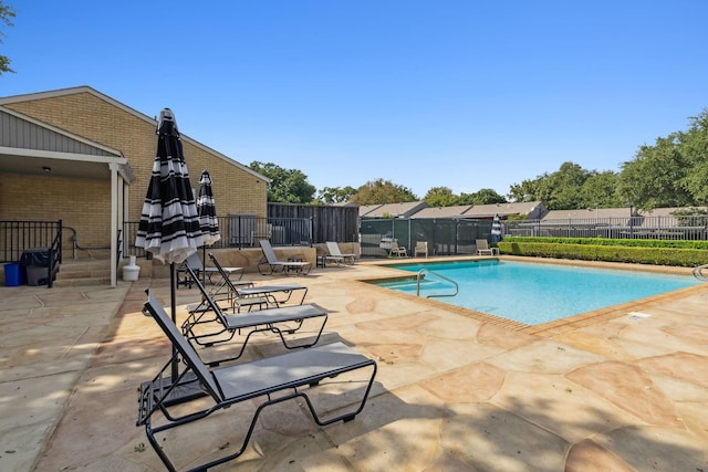 view of pool featuring a patio area