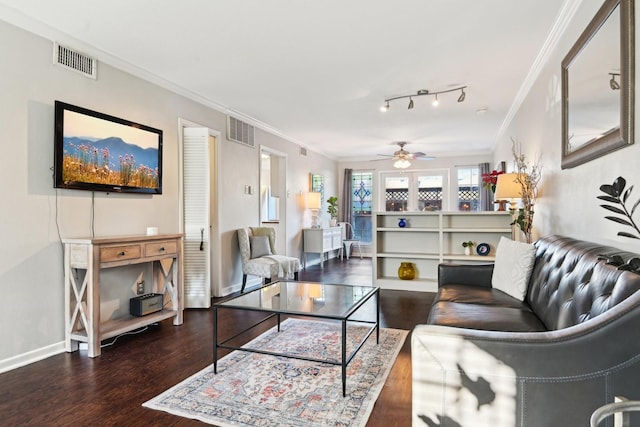 living room featuring hardwood / wood-style flooring, ceiling fan, and crown molding