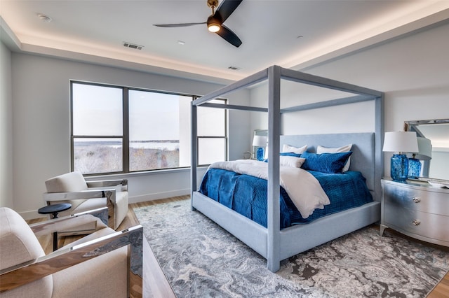 bedroom featuring hardwood / wood-style floors and ceiling fan