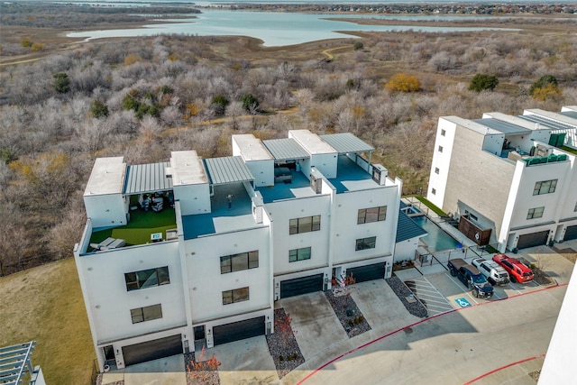 birds eye view of property with a water view