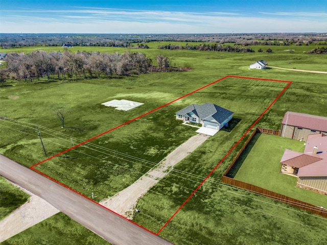 birds eye view of property featuring a rural view