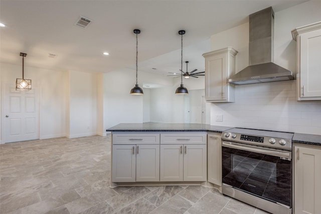 kitchen featuring ceiling fan, wall chimney range hood, decorative light fixtures, electric stove, and decorative backsplash