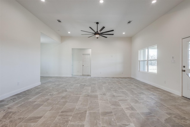 interior space with ceiling fan