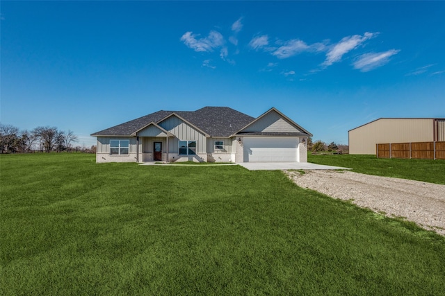 view of front facade featuring a front lawn and a garage