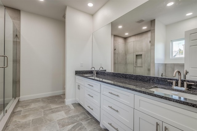 bathroom with vanity and walk in shower