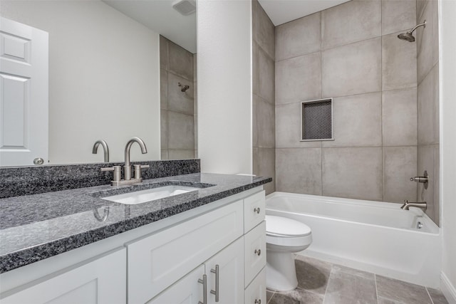 full bathroom featuring vanity, toilet, and tiled shower / bath