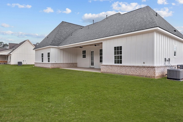 back of house featuring central AC, ceiling fan, a yard, and a patio area