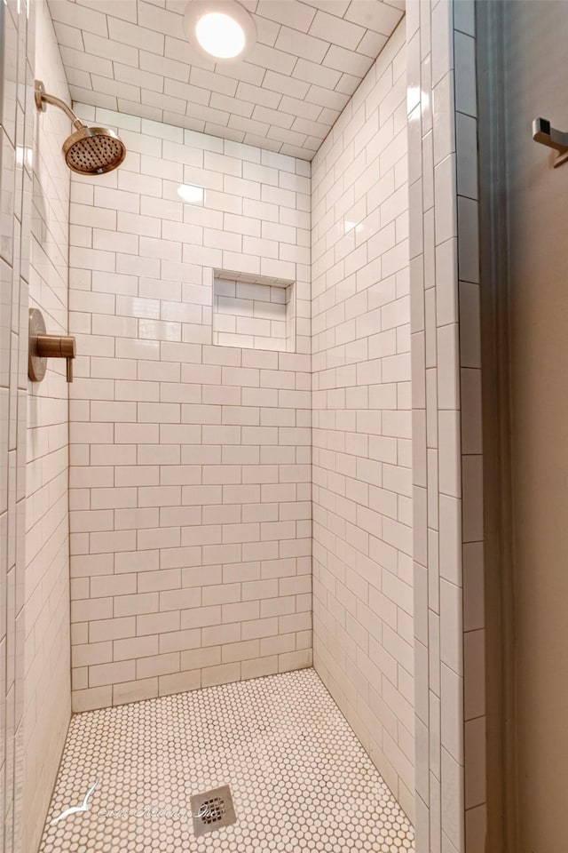 bathroom with a tile shower