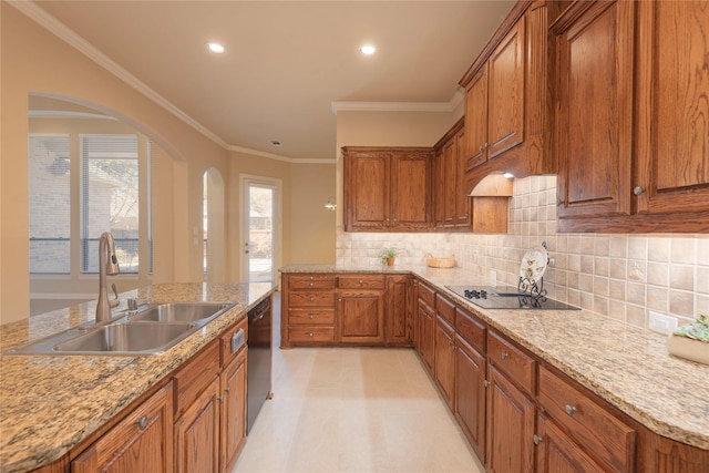 kitchen with arched walkways, a sink, brown cabinets, black appliances, and crown molding