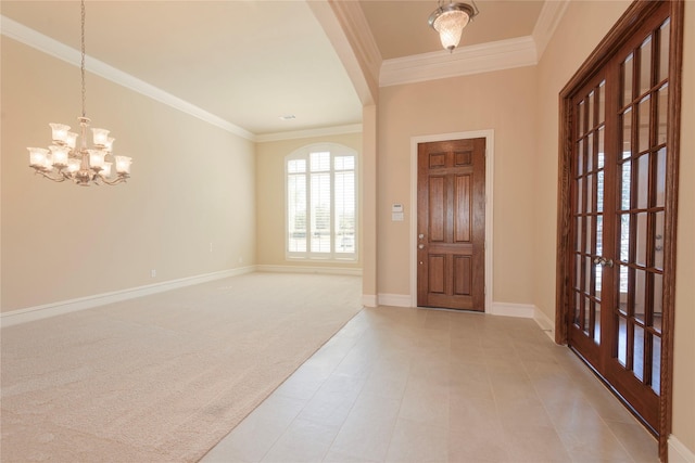 entryway featuring baseboards, ornamental molding, a chandelier, and light colored carpet