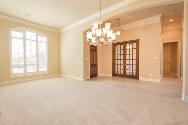 unfurnished room with baseboards, visible vents, ornamental molding, and light colored carpet