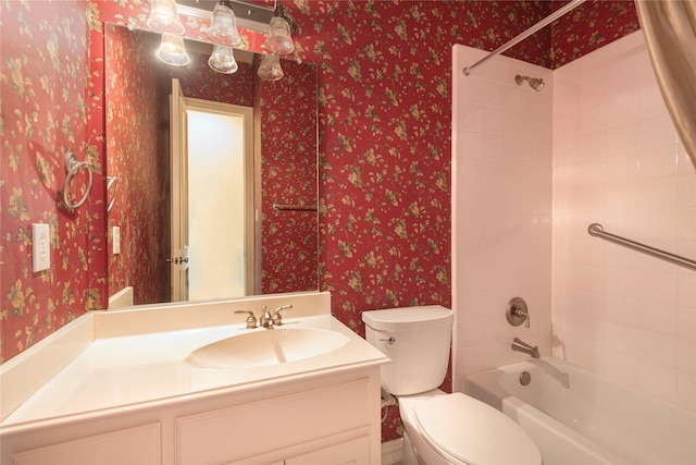 full bathroom with toilet, bathtub / shower combination, vanity, and wallpapered walls