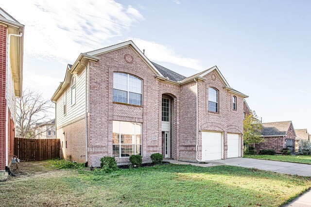 front facade with a front lawn and a garage