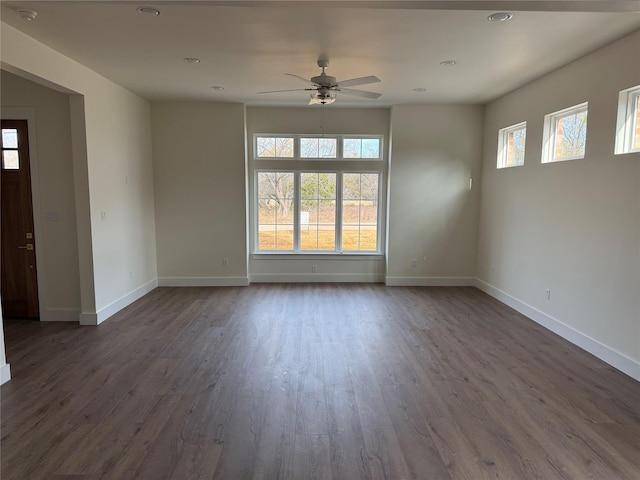 spare room with ceiling fan, baseboards, dark wood finished floors, and recessed lighting