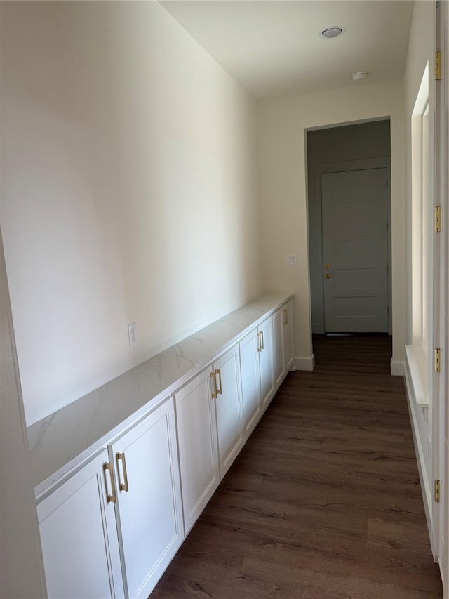 hallway with dark hardwood / wood-style floors