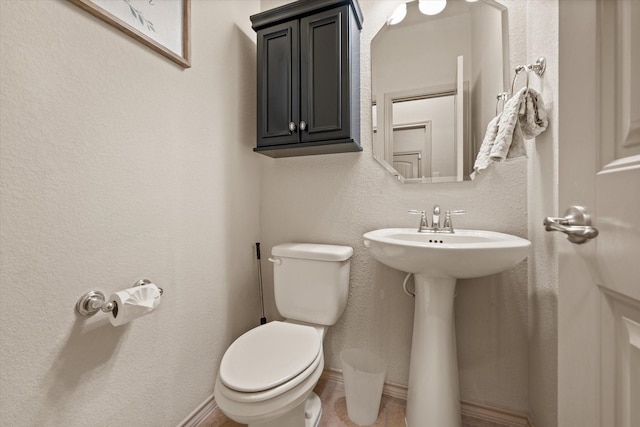 bathroom featuring toilet