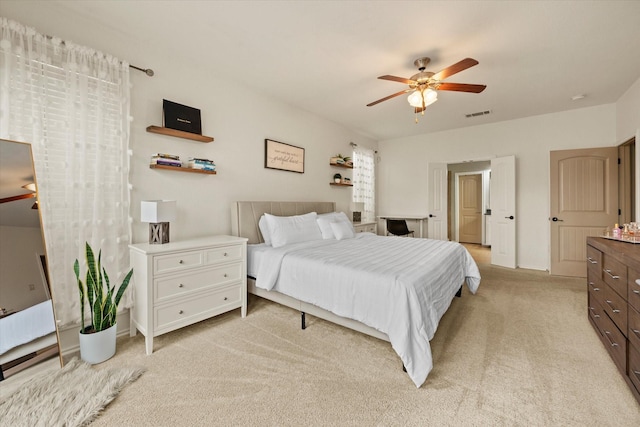 bedroom featuring light carpet and ceiling fan