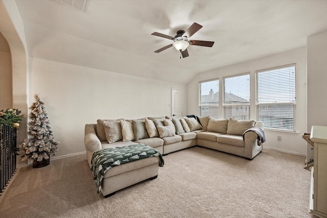 carpeted living room featuring vaulted ceiling and ceiling fan