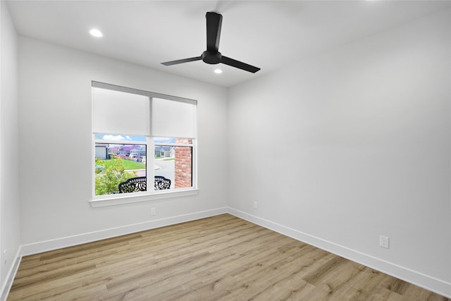 unfurnished room featuring ceiling fan and light wood-type flooring