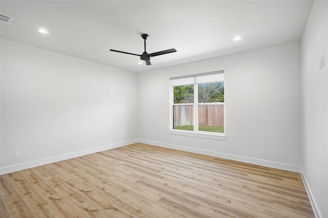 spare room featuring ceiling fan and light wood-type flooring