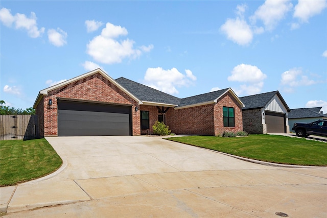 view of front of house with a garage and a front lawn